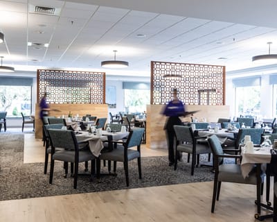 Dining room setup with staff serving