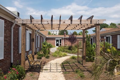 Pathway through an outdoor space with a pergola