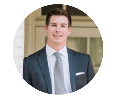 Professional headshot of a man in a suit