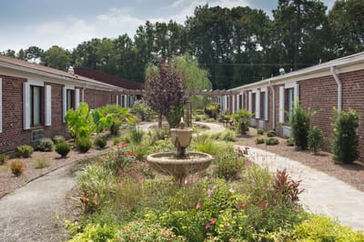 Outdoor courtyard with flowers and a fountain