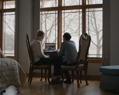 Two residents sharing a moment by the window