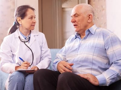 Healthcare professional consulting with a senior resident