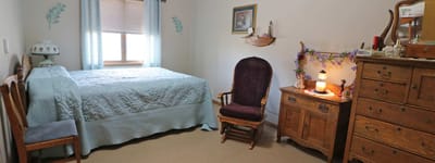 Cozy private resident room with a bed and furniture