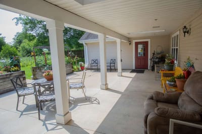Outdoor patio with seating and garden view