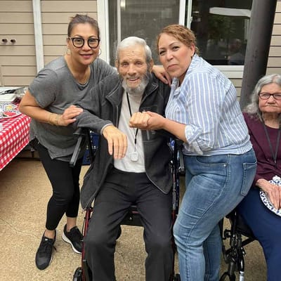 Residents and staff enjoying a gathering outdoors