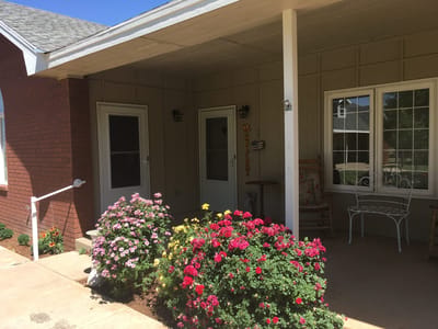 Charming entryway with flowers at the facility
