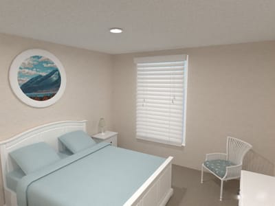 Cozy bedroom with light blue bedding and wall art