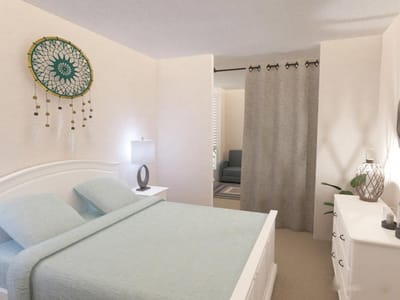 Brightly lit private resident room with bed and decor