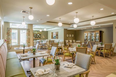 Bright and welcoming dining room with tables and chairs
