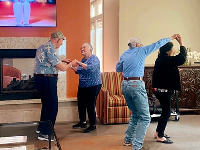 Residents enjoying a dance in the common area
