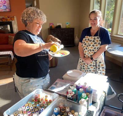 Residents participating in a painting activity