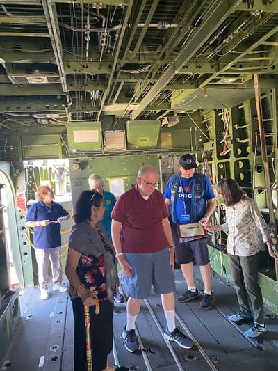 Residents exploring the interior of a historical plane