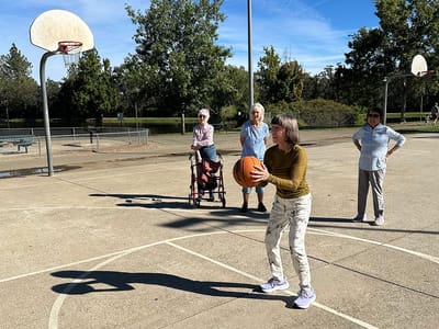 Residents participating in a basketball activity at the facility.
