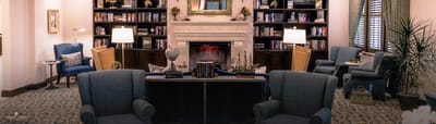 Interior common area with seating and bookshelves