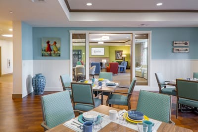 Dining room setup with colorful decor and table settings