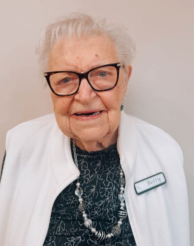 Close-up portrait of a smiling elderly woman named Betty