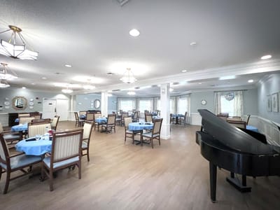 Bright dining room with tables set for meals