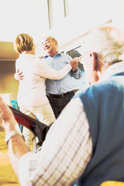 May River Landing, assisted living in Bluffton, SC — Couple dancing joyfully in a warm environment