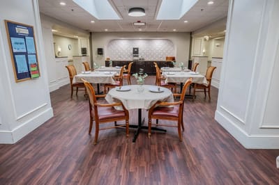 Dining room setup with tables and chairs