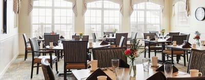 Dining area with tables set for meal service