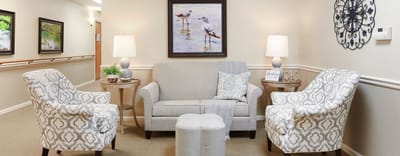 Cozy common area with comfortable seating and art