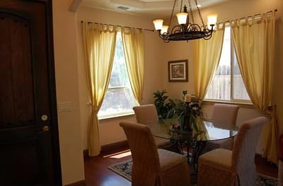 Bright interior space with a dining table and chairs