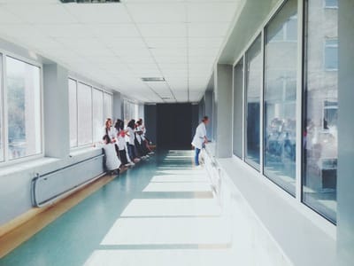 Care staff in a facility hallway interacting