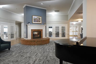 Interior view of a cozy common area with a fireplace