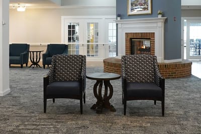Common area with seating and fireplace