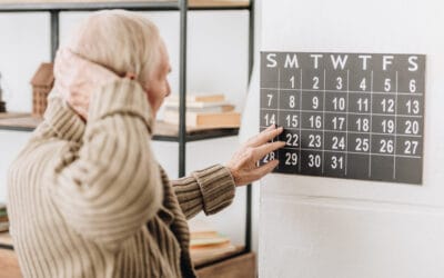 Avamere Rehabilitation of Lebanon, Nursing Home in Lebanon, OR — Senior resident interacting with a calendar on the wall