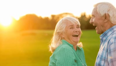 Avamere Rehabilitation of Lebanon, Nursing Home in Lebanon, OR — Seniors laughing together in a sunlit outdoor setting