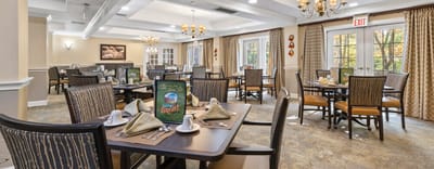 Bright dining room with tables set for a meal