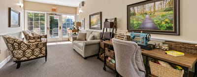 Interior view of a cozy common area with seating and decor
