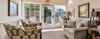 Bright common area with seating and natural light