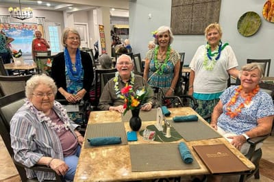 Residents celebrating together in a dining area