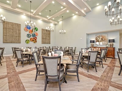 Dining room with tables set for a meal.