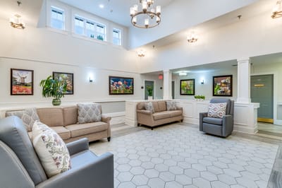 Bright common area with comfortable seating and artwork
