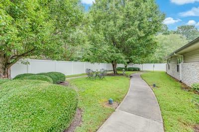 Outdoor garden area with seating and pathways