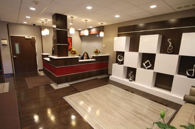 Reception area with a staff member at the front desk