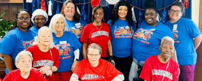 Staff and residents celebrating in vibrant t-shirts