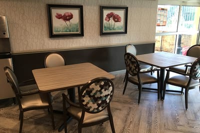 Dining room area with tables and chairs