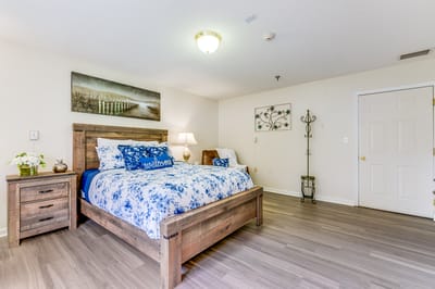 Cozy bedroom with wooden furniture and decor