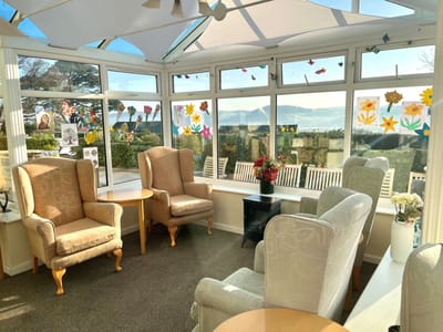 Bright and inviting sunroom with comfortable seating