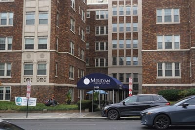Exterior view of the facility's entrance with a branded awning