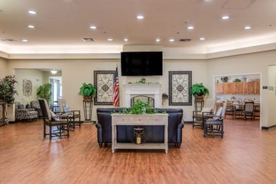 Bright common area with seating and kitchenette