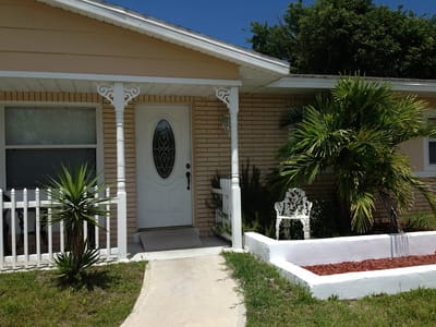 Front entrance of a senior living facility with landscaping