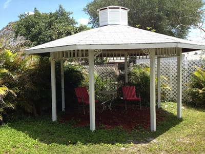 Outdoor gazebo with seating in a garden
