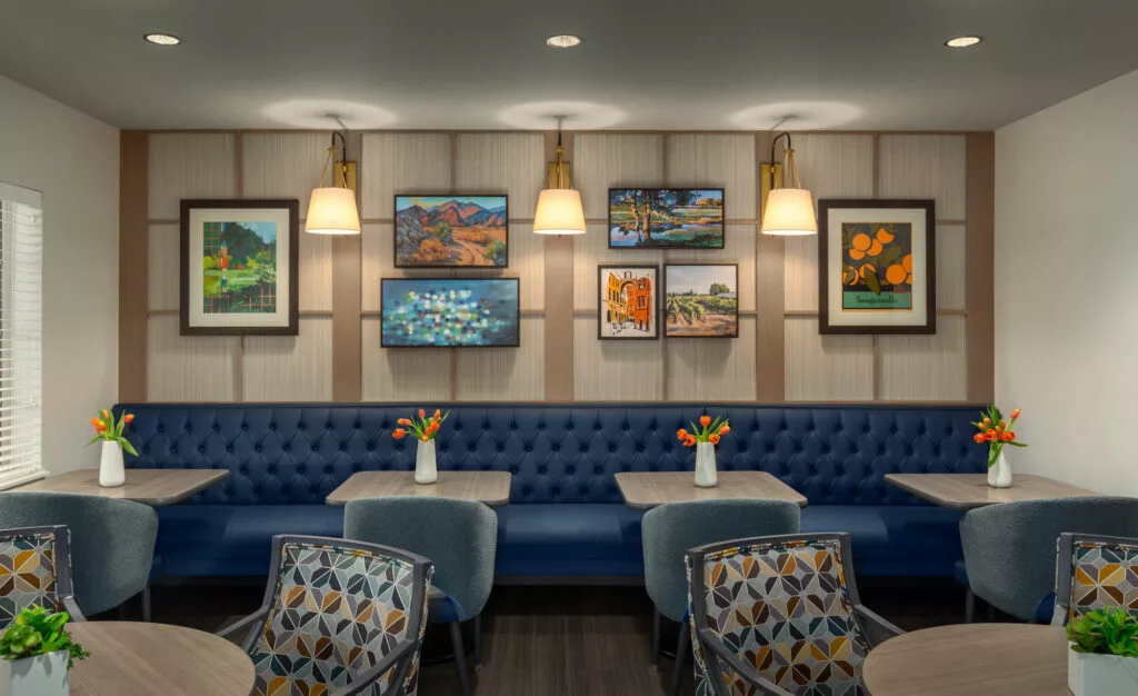 Interior dining area with decorative artwork and seating