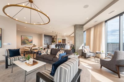 Stylish common area with modern furniture and large windows