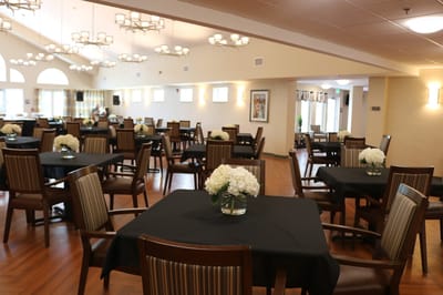 Dining area with tables and flower centerpieces